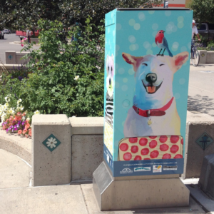 Electric box artistically painted with dog